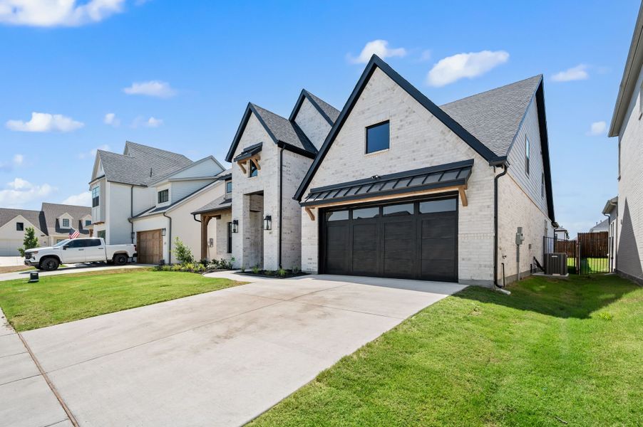 Front exterior of a new home in Parks of Aledo, Aledo, TX, highlighting curb appeal (Image 24).