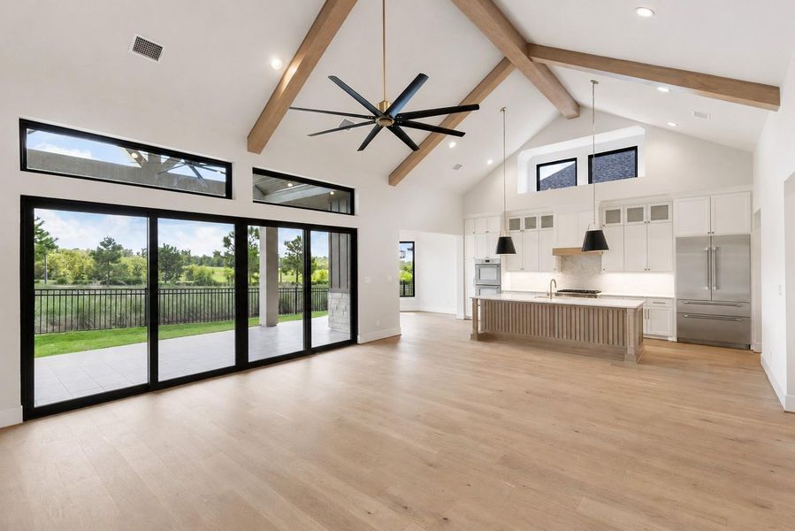 Sliding glass doors lead to covered lanai with summer kitchen and unmatched views. Sliding glass doors lead to covered lanai with summer kitchen and unmatched views.