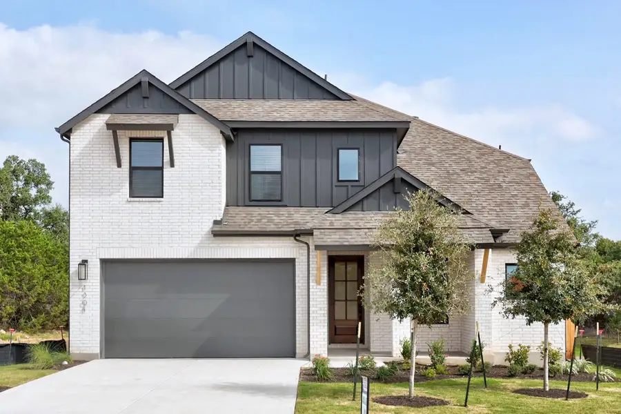 Front exterior of a new home in Parkside Peninsula, Georgetown, TX, highlighting curb appeal (Image 1). Front exterior of a new home in Parkside Peninsula, Georgetown, TX, highlighting curb appeal (Image 1).