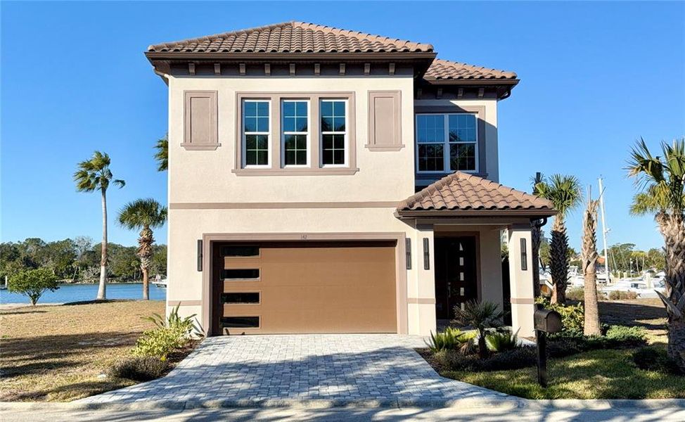 Front exterior of a new home in , Palm Coast, FL, highlighting curb appeal (Image 1). Front exterior of a new home in , Palm Coast, FL, highlighting curb appeal (Image 1).