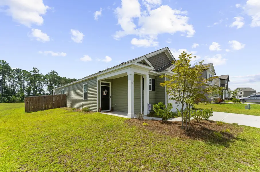 Exterior details and patio area of a home in Pine Hills at Cane Bay, Summerville (Image 28).
