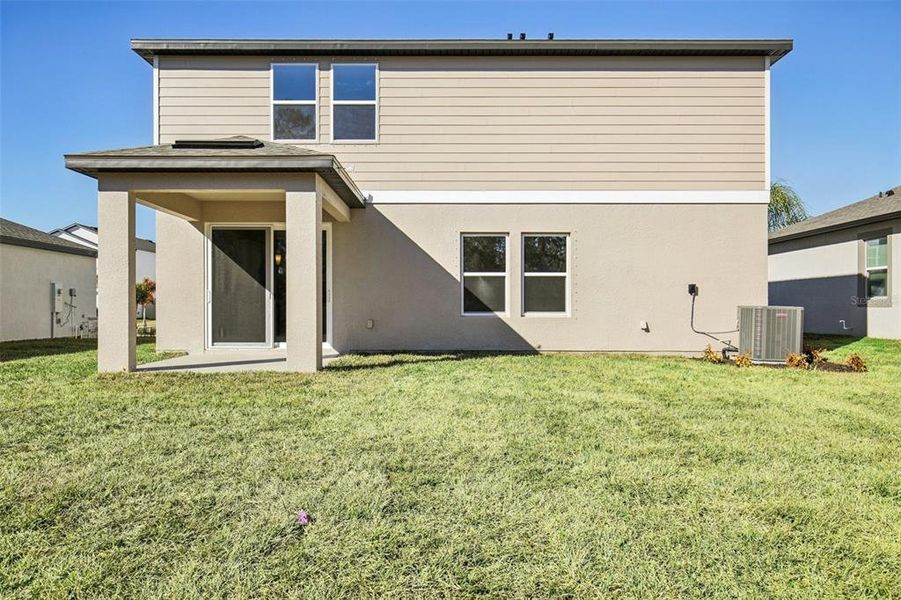 Exterior details and patio area of a home in Berry Bay, Wimauma (Image 4).