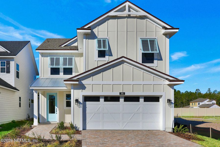 Front exterior of a new home in Seabrook Village at Seabrook, Ponte Vedra, FL, highlighting curb appeal (Image 24).