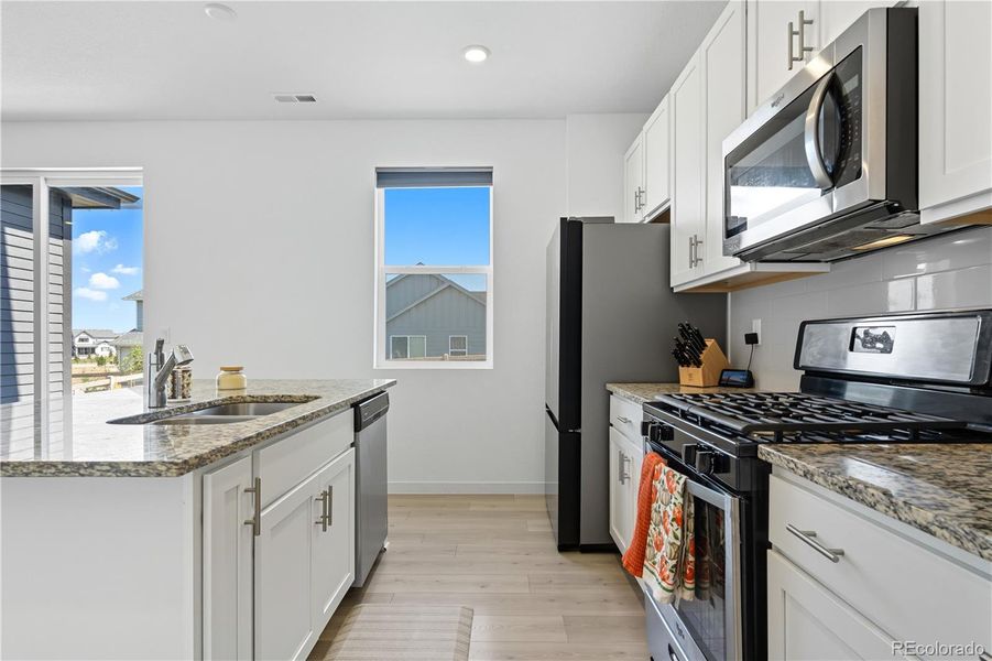 Furnished interior view inside a new home in Ascent Village at Sterling Ranch - Single Family Homes, Littleton (Image 13). Furnished interior view inside a new home in Ascent Village at Sterling Ranch - Single Family Homes, Littleton (Image 13).
