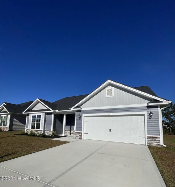 Front exterior of a new home in Athens Acres, New Bern, NC, highlighting curb appeal (Image 18). Front exterior of a new home in Athens Acres, New Bern, NC, highlighting curb appeal (Image 18).
