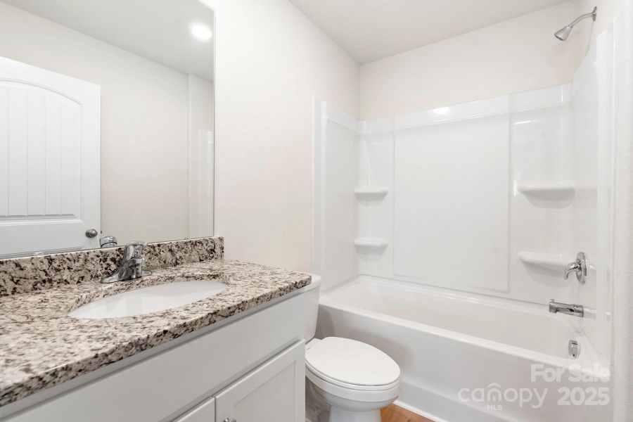 Furnished interior view inside a new home in Stagecoach Station, Gastonia (Image 4).