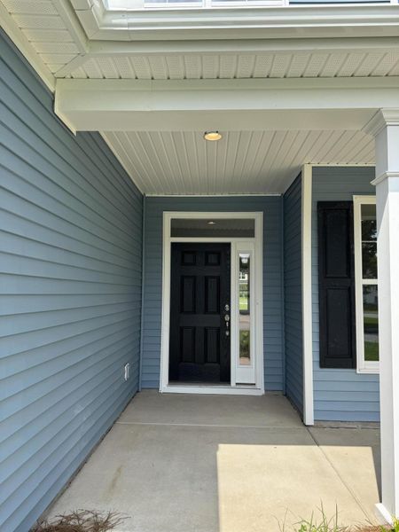 Front exterior of a new home in Oakley Pointe, Moncks Corner, SC, highlighting curb appeal (Image 24).