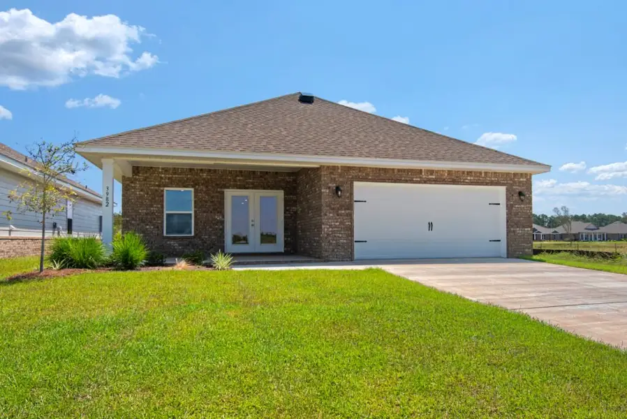 Front exterior of a new home in Yellow River Ranch, Milton, FL, highlighting curb appeal (Image 13). Front exterior of a new home in Yellow River Ranch, Milton, FL, highlighting curb appeal (Image 13).