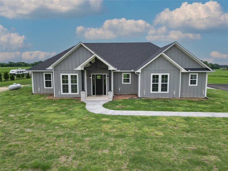 Front exterior of a new home in , Point, TX, highlighting curb appeal (Image 2).
