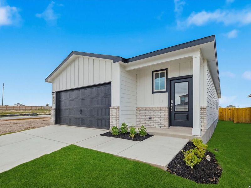Front exterior of a new home in Agave, San Antonio, TX, highlighting curb appeal (Image 16). Front exterior of a new home in Agave, San Antonio, TX, highlighting curb appeal (Image 16).