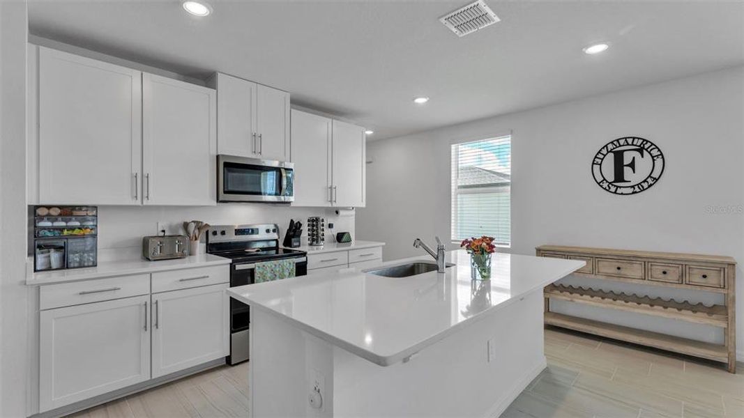Furnished interior view inside a new home in The Grove at Stuart Crossing - Premier Series, Bartow (Image 17).