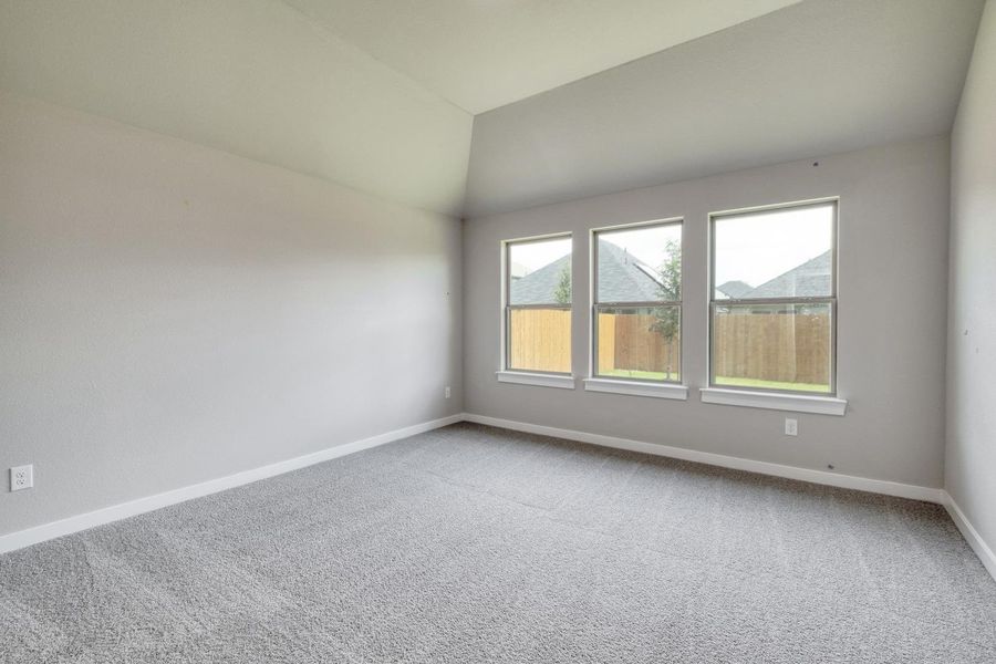 A spacious room offers ample natural light and a clean, versatile interior. A spacious room offers ample natural light and a clean, versatile interior.