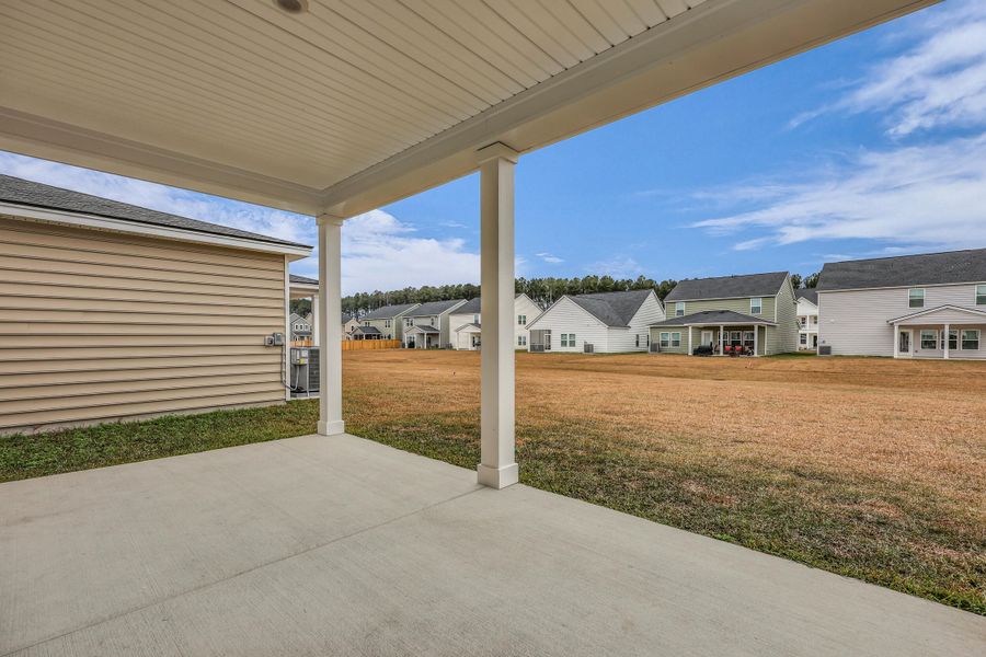 Exterior details and patio area of a home in Sweetgrass at Summers Corner: Carolina Collection, Summerville (Image 32).