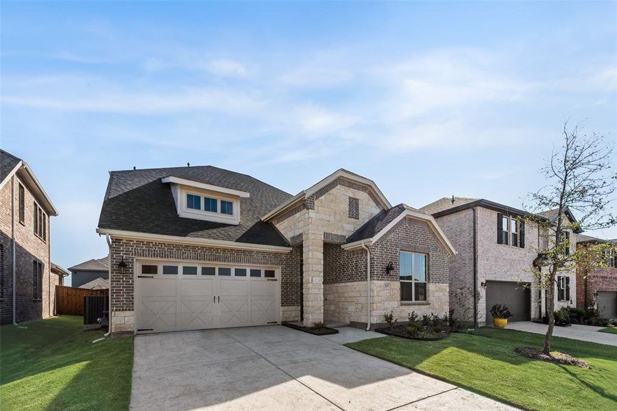 Front exterior of a new home in Villages of Hurricane Creek, Anna, TX, highlighting curb appeal (Image 1). Front exterior of a new home in Villages of Hurricane Creek, Anna, TX, highlighting curb appeal (Image 1).