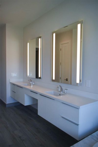 Master Bath double vanity sinks and backlit mirros