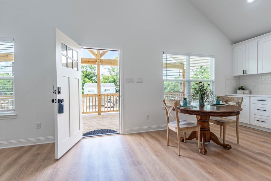 Enjoy your morning coffee or evening cocktail outside. Front door leads to the outside covered deck/patio.
