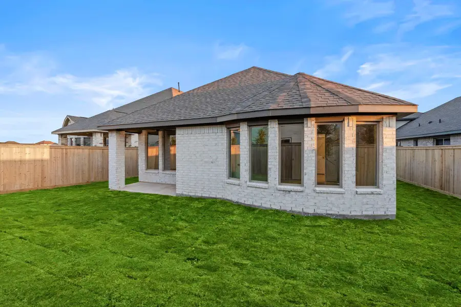 Exterior details and patio area of a home in Bridgeland, Cypress (Image 4).
