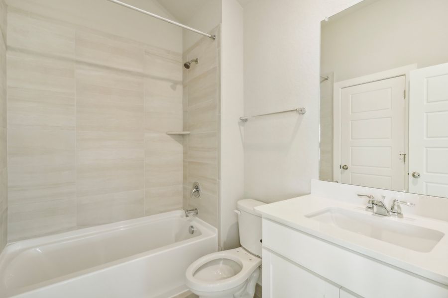 Guest bathroom in the Cedar floorplan at a Meritage Homes community.