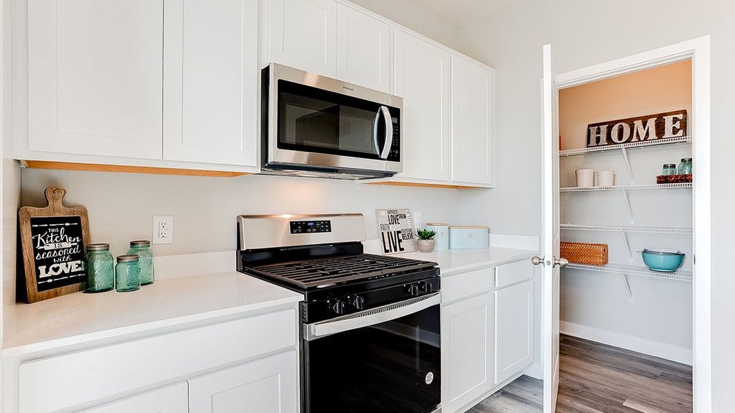 Representative furnished interior of a home built from the The Sienna by D.R. Horton in Thornton Townes, Raleigh (Image 11).