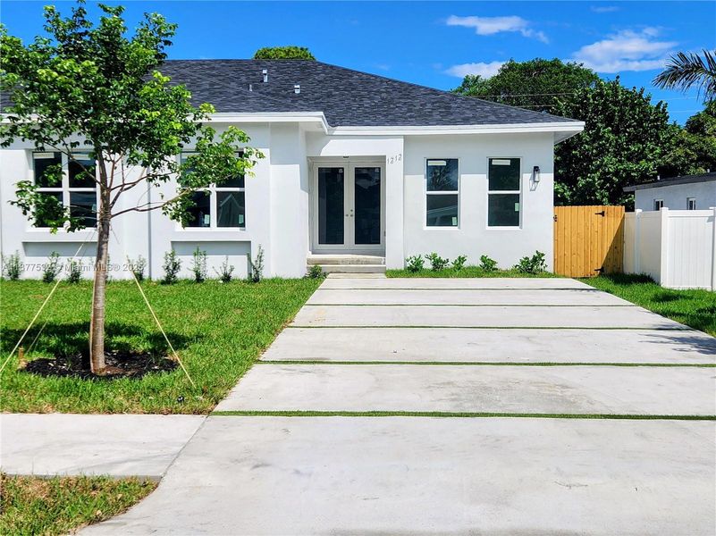 Front exterior of a new home in , Fort Lauderdale, FL, highlighting curb appeal (Image 1).