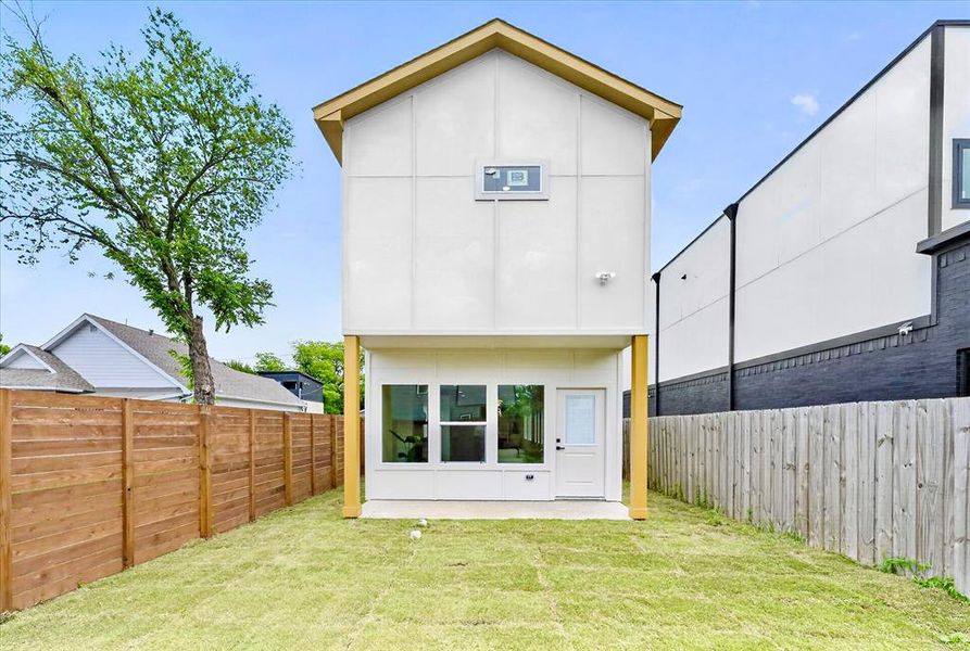 Modern vertical siding exterior with wood-finish trim accents