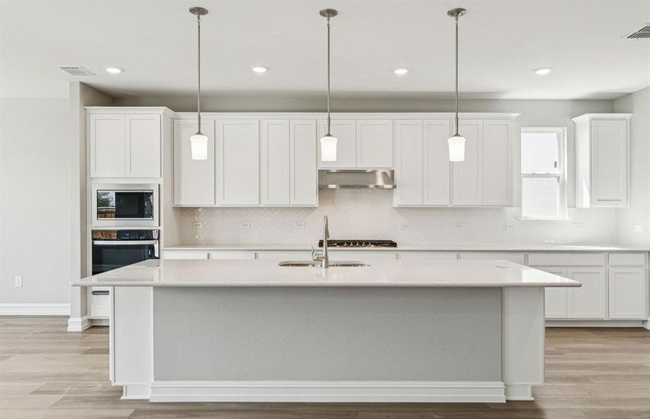 Spacious kitchen with eat-in bartop island
