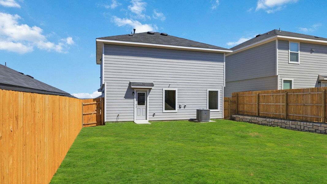 Exterior details and patio area of a home in Wayside, Uhland (Image 16).