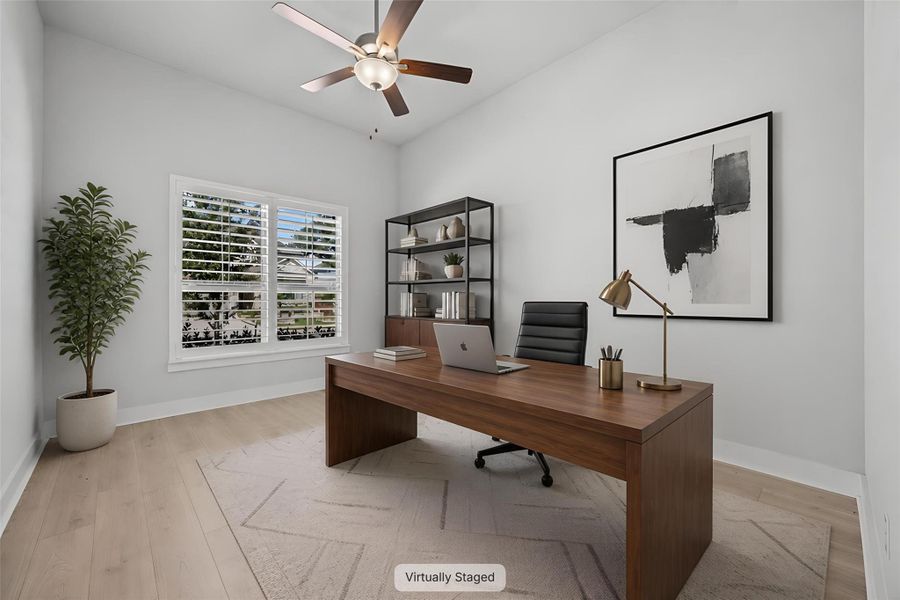 A well-appointed home office provides a dedicated workspace with ample natural light and clean lines.