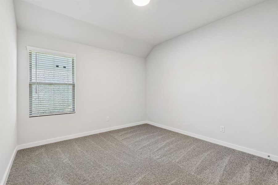 Bedroom in the Oscar home plan by Trophy Signature Homes – REPRESENTATIVE PHOTO