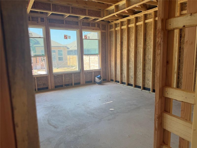 Exposed framing and concrete subfloors await final customization in this under-construction space.