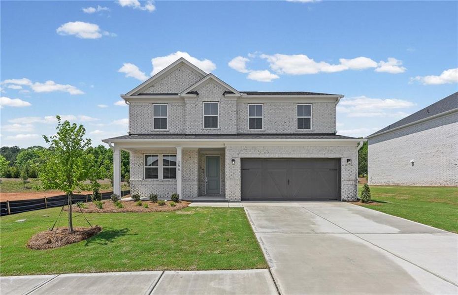 Front exterior of a new home in Overland, Locust Grove, GA, highlighting curb appeal (Image 21).