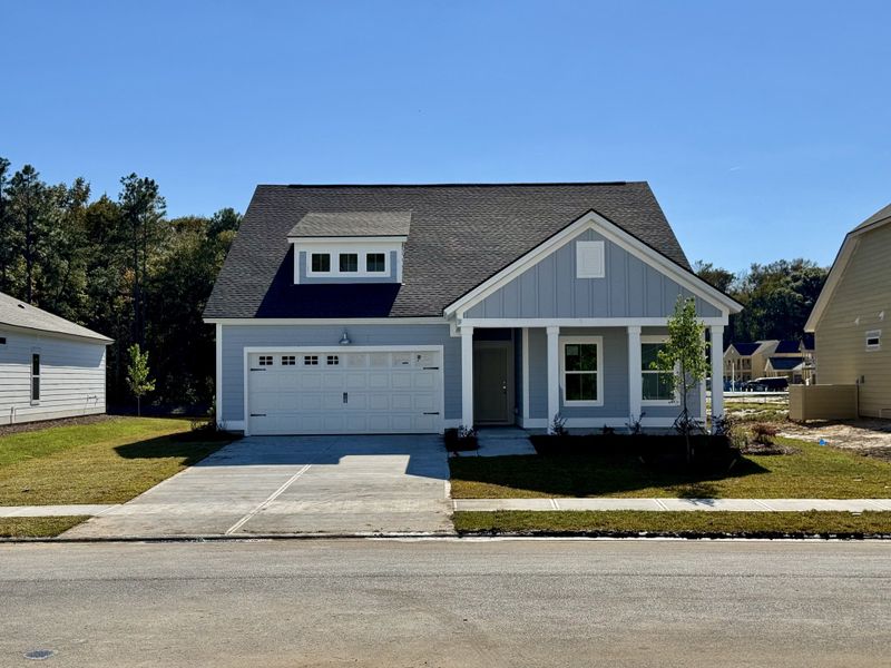Front exterior of a new home in Savannah Quarters: Arbor Collection 60s, Pooler, GA, highlighting curb appeal (Image 1).