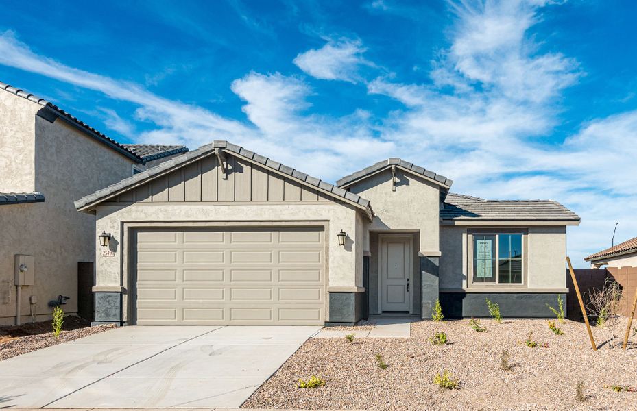 Front exterior of a new home in Artisan at Asante, Surprise, AZ, highlighting curb appeal (Image 1). Front exterior of a new home in Artisan at Asante, Surprise, AZ, highlighting curb appeal (Image 1).