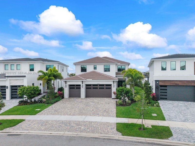 Front exterior of a new home in Solana Bay at Avenir, Palm Beach Gardens, FL, highlighting curb appeal (Image 2).