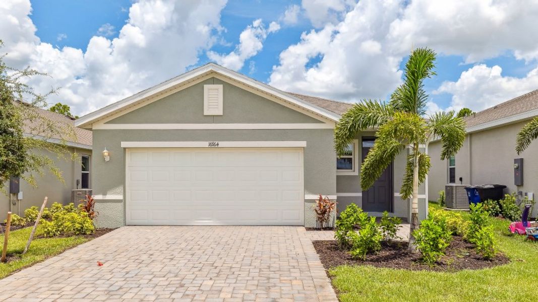 Representative exterior photo of a completed home built from the HARPER by D.R. Horton in Coral Bay - Express & Tradition, North Fort Myers, FL (Image 1).