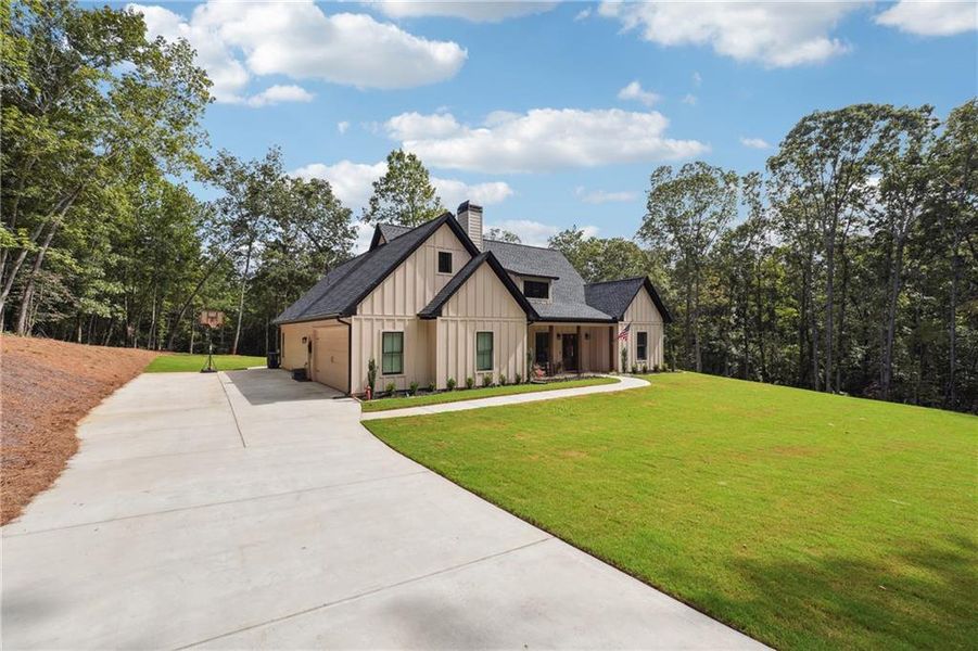 Front exterior of a new home in , Winston, GA, highlighting curb appeal (Image 1). Front exterior of a new home in , Winston, GA, highlighting curb appeal (Image 1).