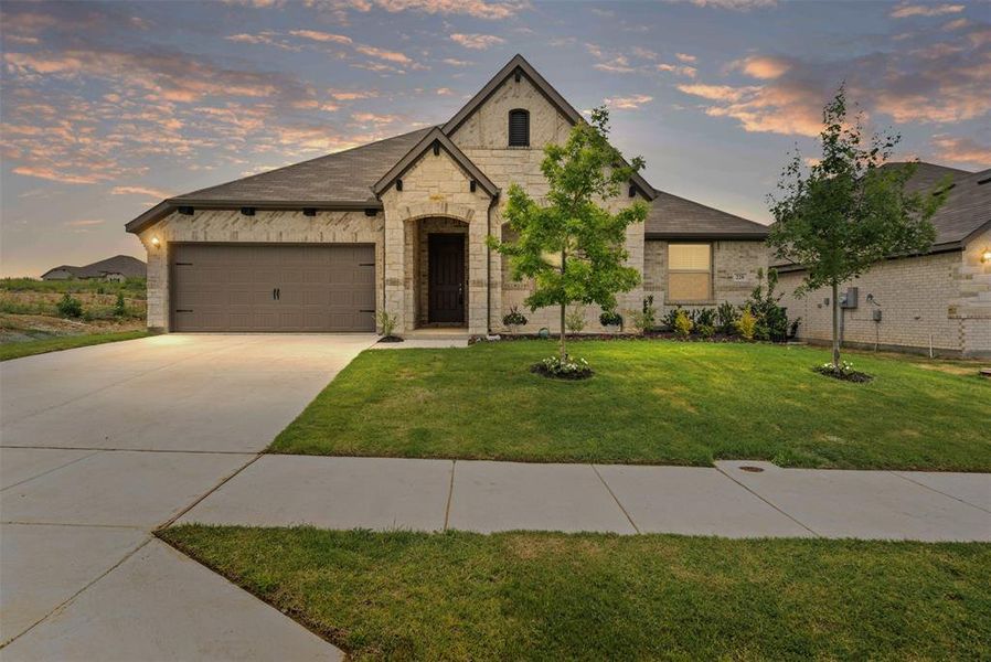 Front exterior of a new home in , Godley, TX, highlighting curb appeal (Image 22).