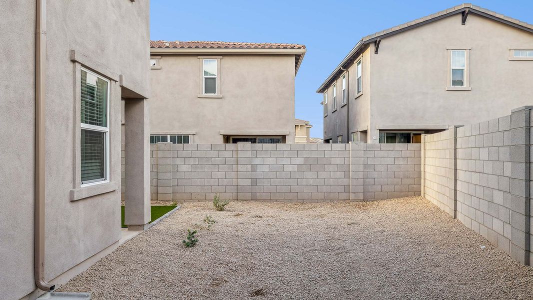 Exterior details and patio area of a home in Talinn Towns at Desert Ridge, Phoenix (Image 3).