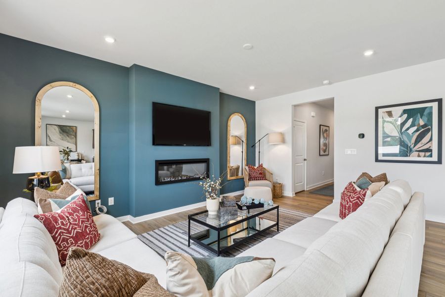 A living room with a large blue wall. A living room with a large blue wall.