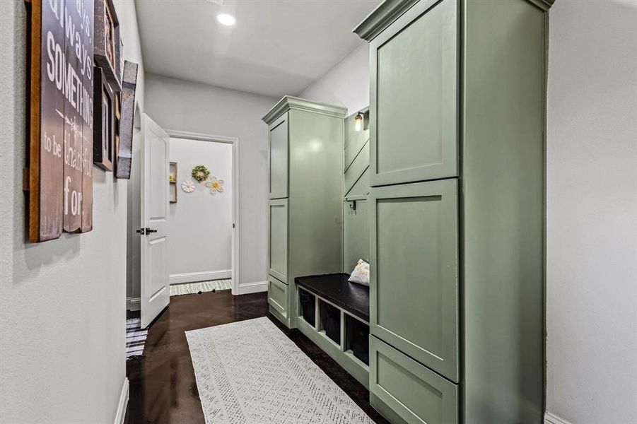 Mudroom featuring baseboards and dark wood-style floors Mudroom featuring baseboards and dark wood-style floors