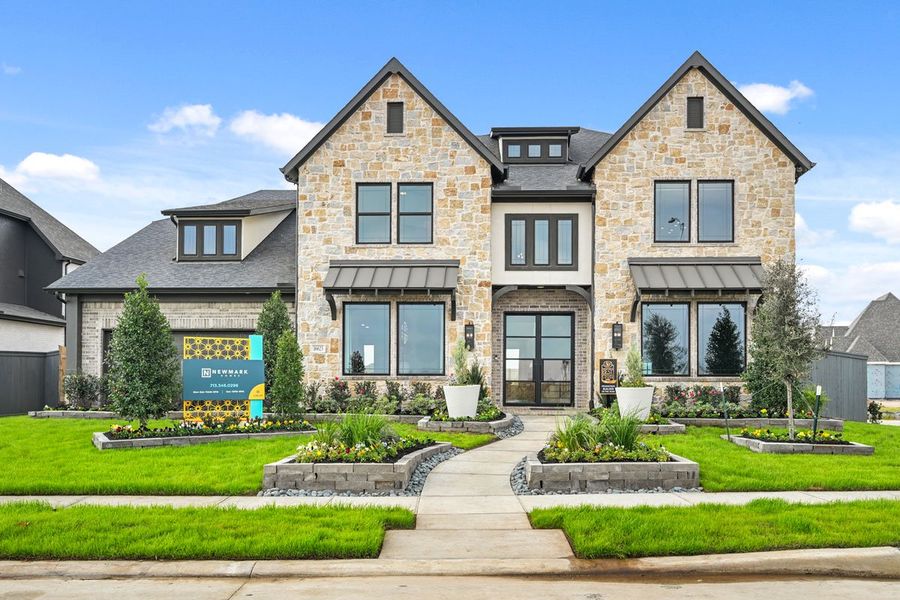 Front exterior of a new home in Jubilee 45', 50', 70', Hockley, TX, highlighting curb appeal (Image 2). Front exterior of a new home in Jubilee 45', 50', 70', Hockley, TX, highlighting curb appeal (Image 2).
