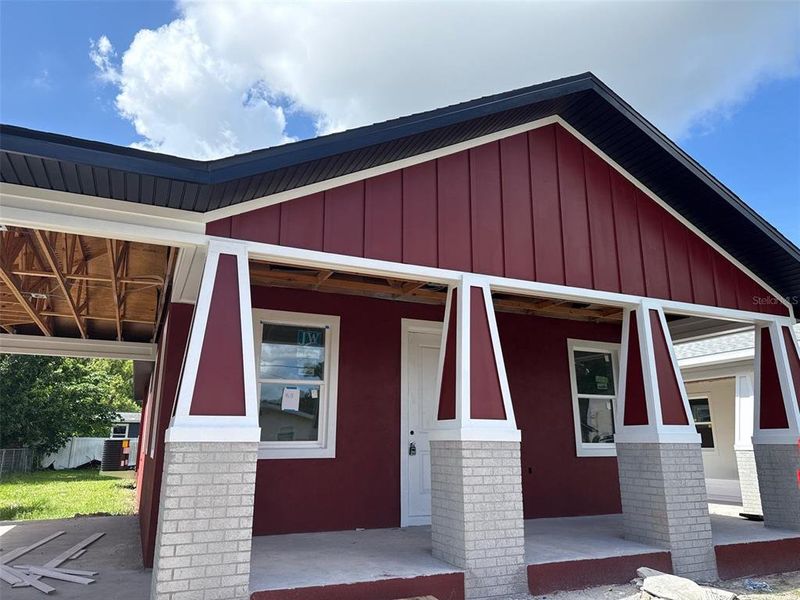 Front exterior of a new home in , Tampa, FL, highlighting curb appeal (Image 12).