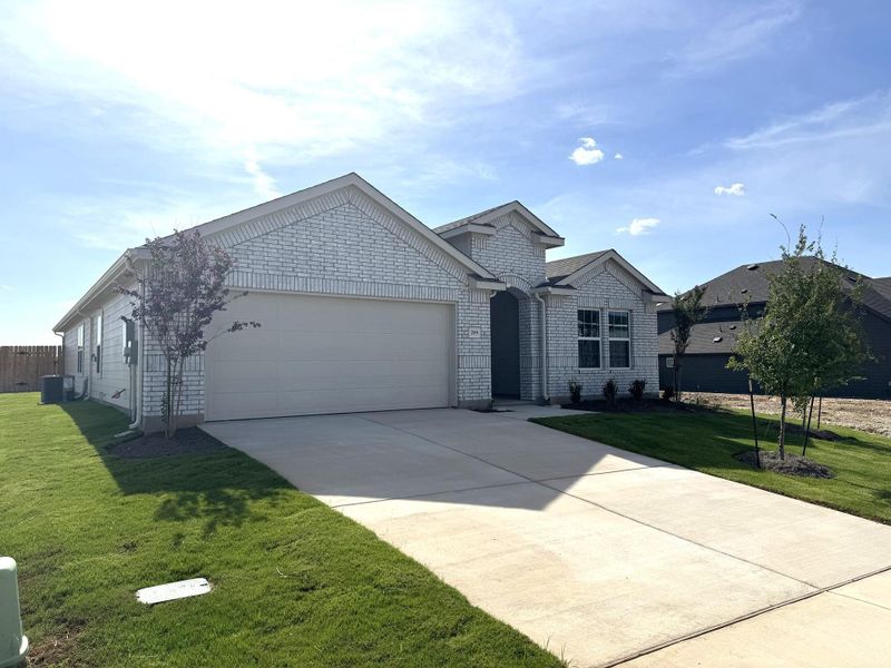 Front exterior of a new home in Hunters Glen, Jarrell, TX, highlighting curb appeal (Image 1). Front exterior of a new home in Hunters Glen, Jarrell, TX, highlighting curb appeal (Image 1).
