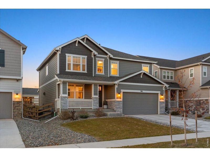 Front exterior of a new home in Prairie Song, Windsor, CO, highlighting curb appeal (Image 2).