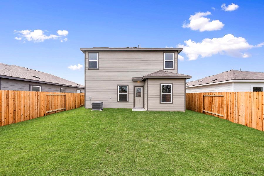 Front exterior of a new home in , Elgin, TX, highlighting curb appeal (Image 2). Front exterior of a new home in , Elgin, TX, highlighting curb appeal (Image 2).