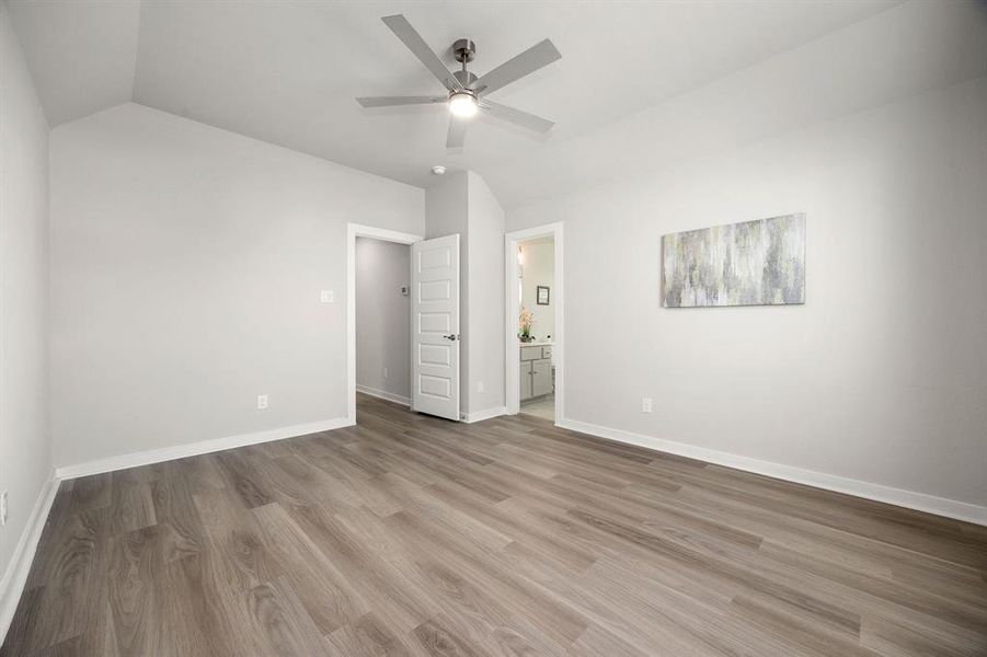 The third upstairs bedroom features its own private bathroom, making it a perfect second master suite.