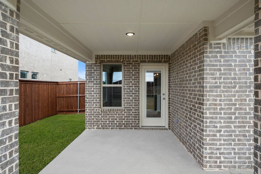 Front exterior of a new home in Myrtle Creek, Waxahachie, TX, highlighting curb appeal (Image 28). Front exterior of a new home in Myrtle Creek, Waxahachie, TX, highlighting curb appeal (Image 28).