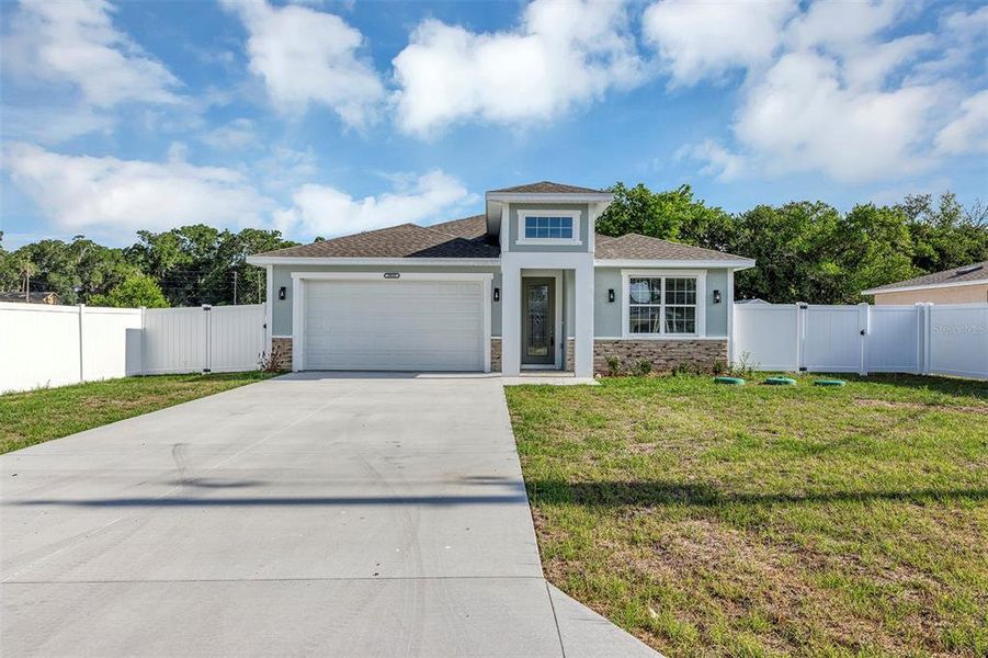 Front exterior of a new home in , Summerfield, FL, highlighting curb appeal (Image 22).