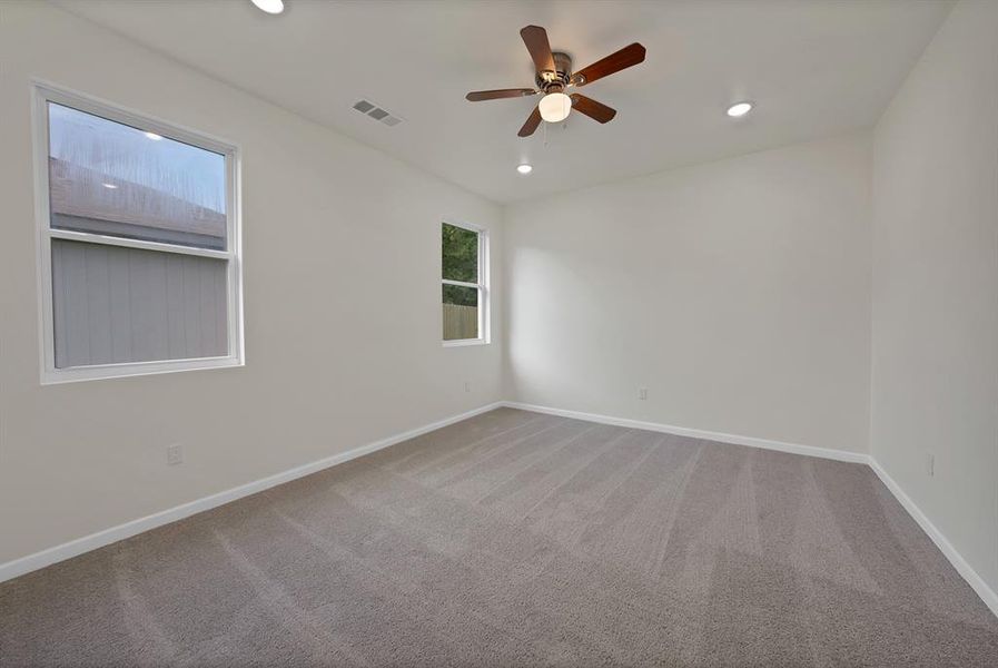Unfurnished room with carpet, a ceiling fan, and recessed lighting