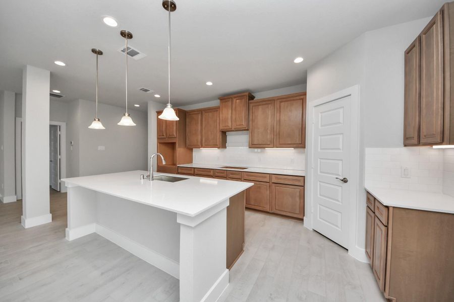 The extended counter area adds both practicality and style, making meal preparation a breeze. Every detail is thoughtfully designed to enhance the kitchen's functionality and aesthetic appeal.